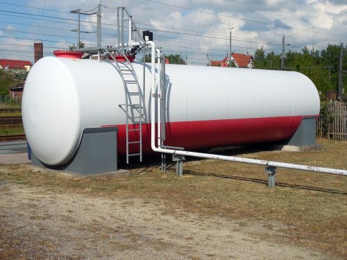 large white and red fuel storage tank