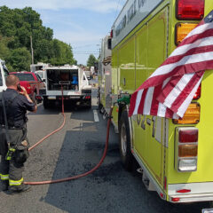 Fire truck fueling at scrapyard fire in Darby Township